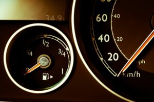 Car fuel gauge pointing at empty