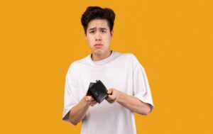 asian man sad face empty wallet